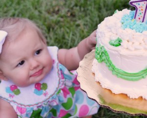 Stevie Reaching for her First Birthday Cake