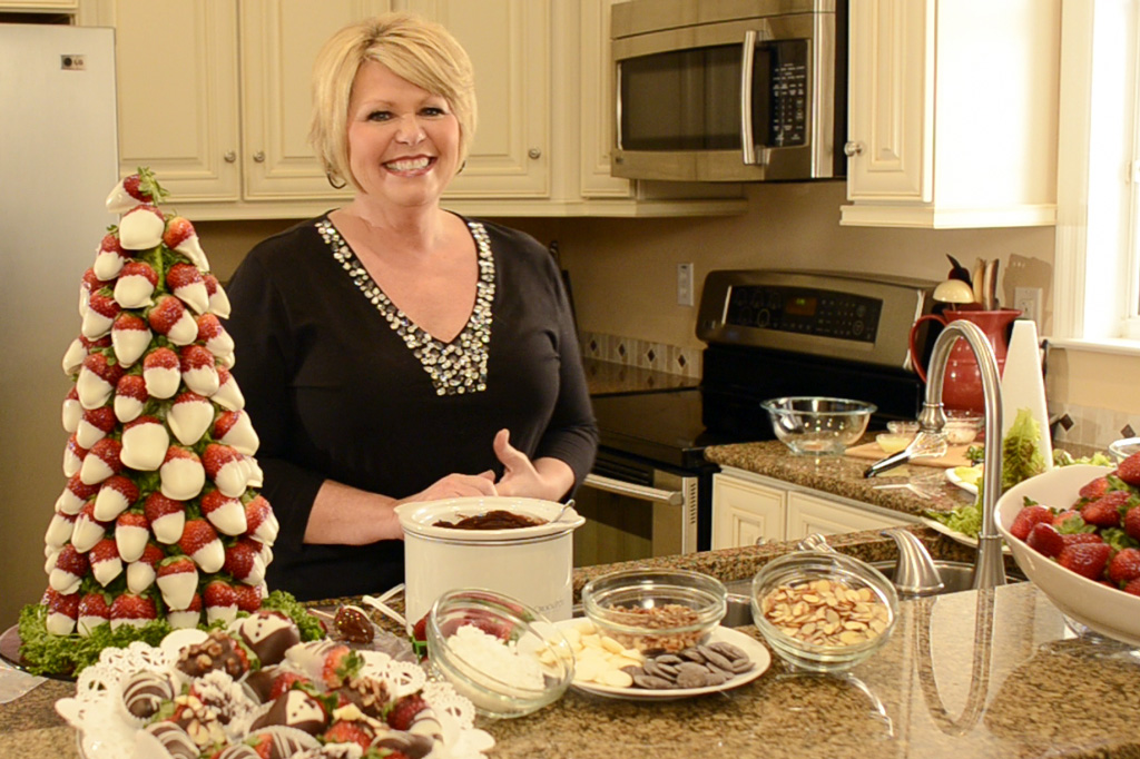 Strawberry Sue making a strawberry Christmas tree