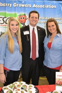 Representative Jake Raburn with Florida Strawberry Growers Association Ambassadors Morgan and Miranda